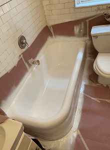 Freshly reglazed white bathtub during bathtub refinishing project in Angleton, TX bathroom