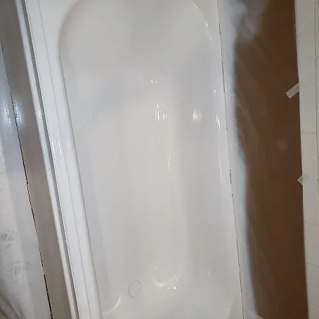 Refinished white bathtub with a glossy finish