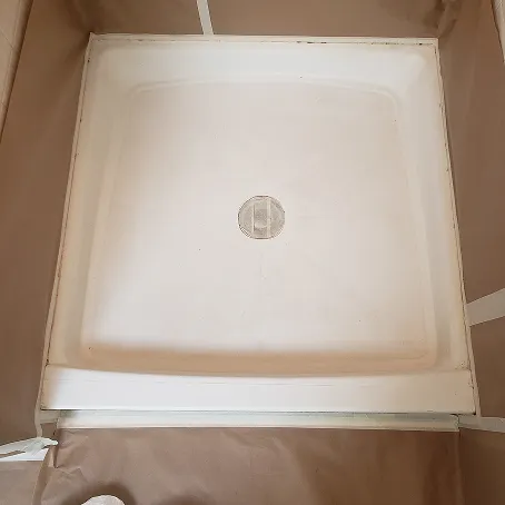 Refinished white shower base with glossy finish