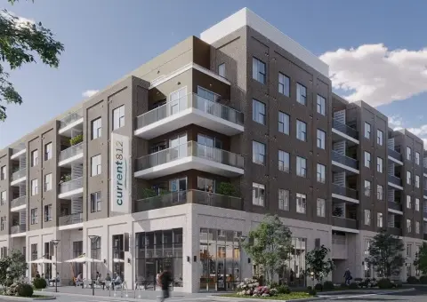 Modern apartment building with balconies and retail spaces