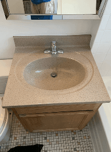 Professionally refinished bathroom sink and vanity in Angleton, TX