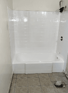 Bathtub and tile surround refinishing completed in Angleton, TX with bright white glossy finish